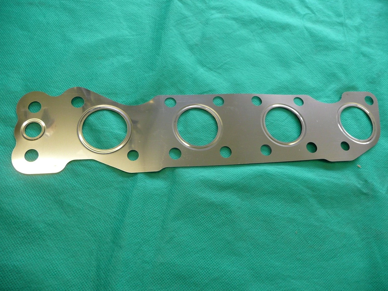 sortömítés kipufogó Ignis, Wagon, Swift 2005-, SX4, S-Cross, Vitara 2015- 14140-69G02, (M13, M15, M16)  gyári